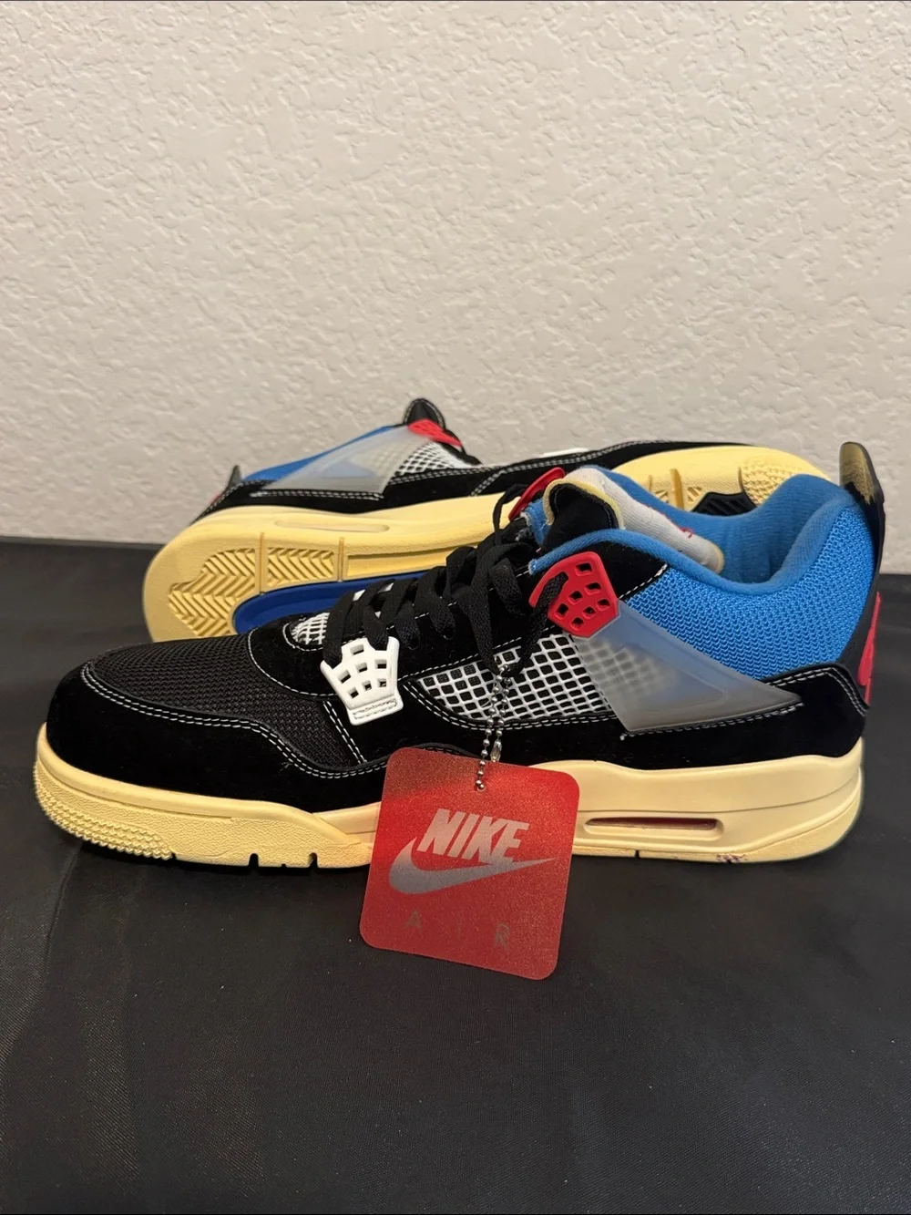 Nike Air Jordan 4 Retro UN/LA - Black/Blue/Red/Cream